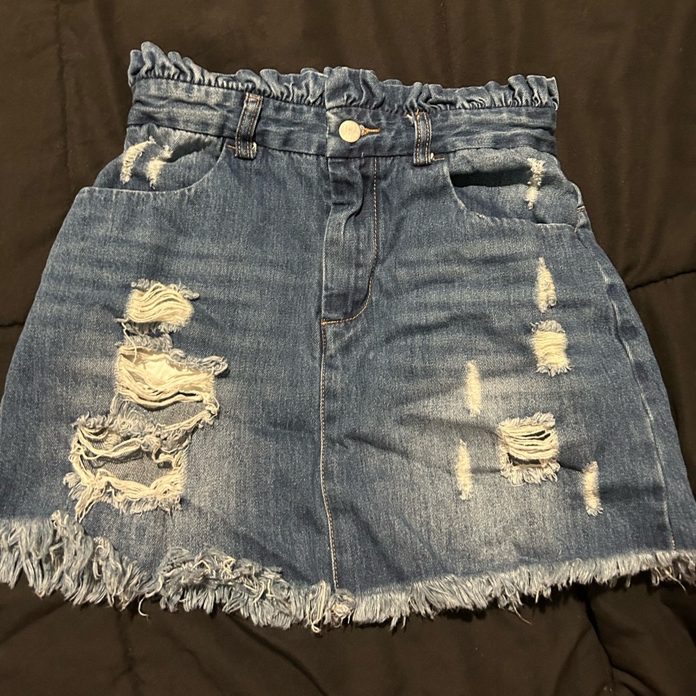 Size small mini blue skirt with holes.